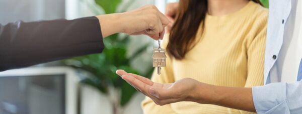 couple being handed house keys