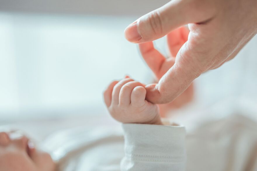 Baby Holding HAnd 