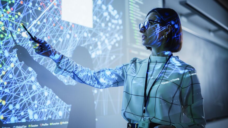 Young Female Teacher Giving a Data Science Presentation