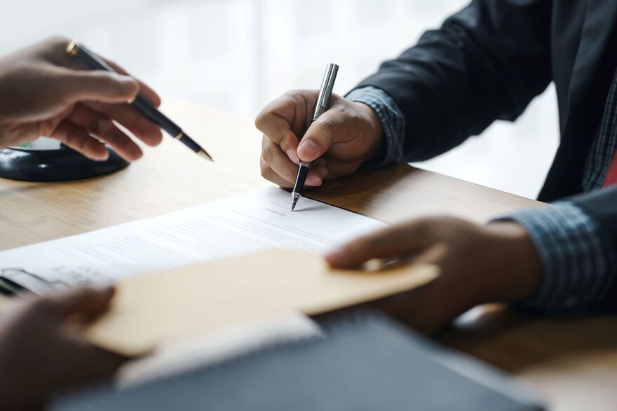 Man Signing a Form