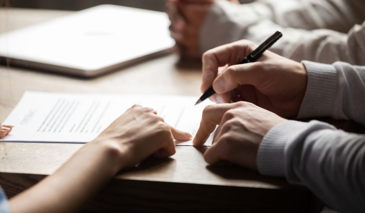 Solicitor pointing at insurance contract