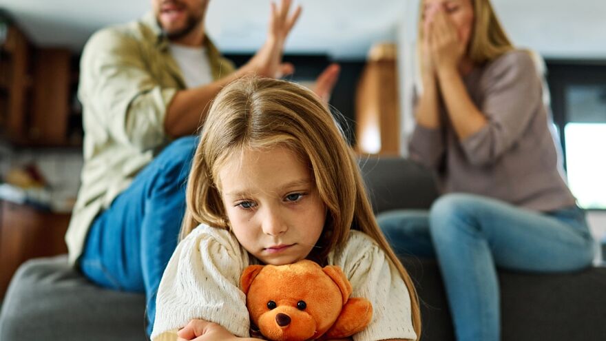 Parents fighting infront of upset child 