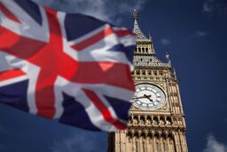 British union jack flag and Big Ben Clock Towe at city of Westminster in the background