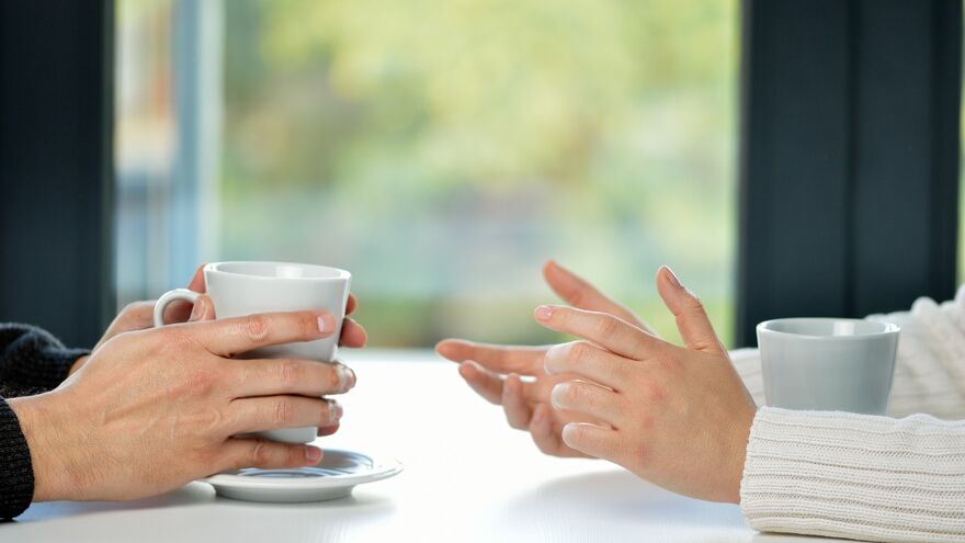 People having conversation over tea