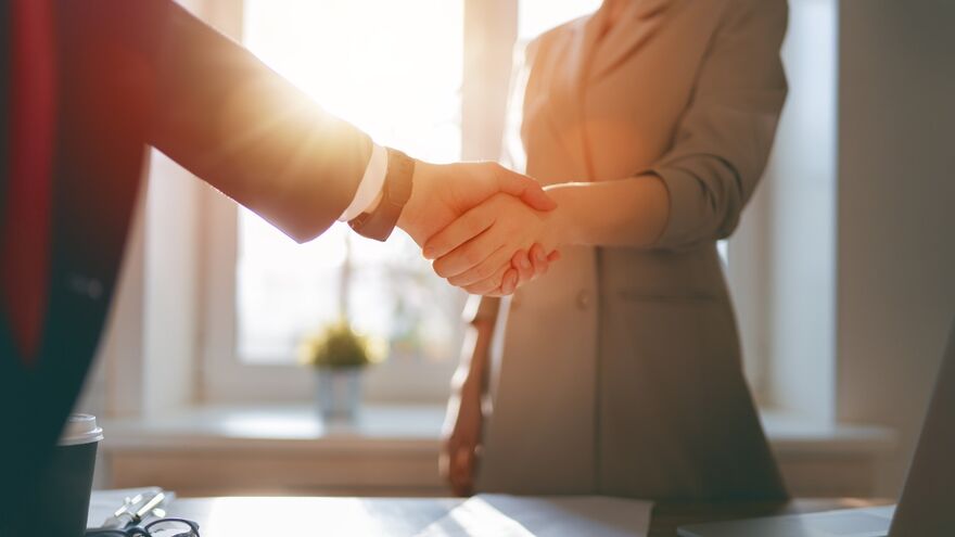 Man and woman shaking hands