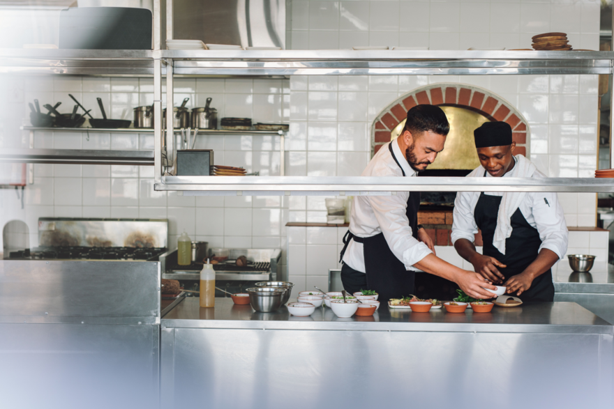two chefs in restaurant kitchen