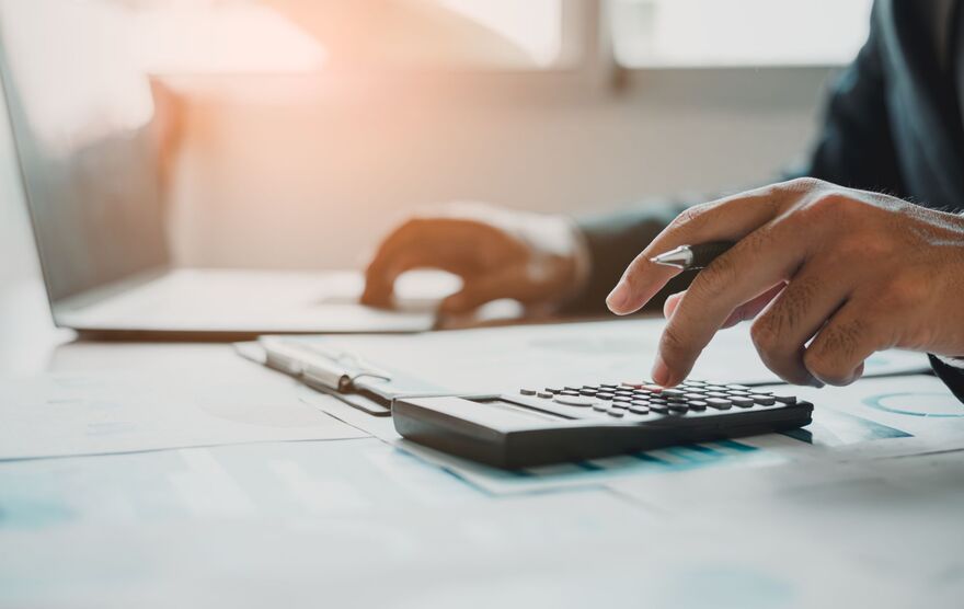 Businessman calculate a financial documents