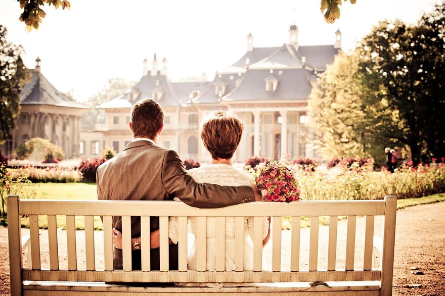 Bride and Groom on bench 