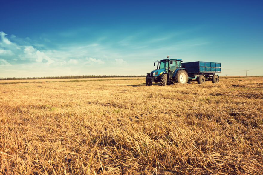 Agriculture - tractor harvesting field 