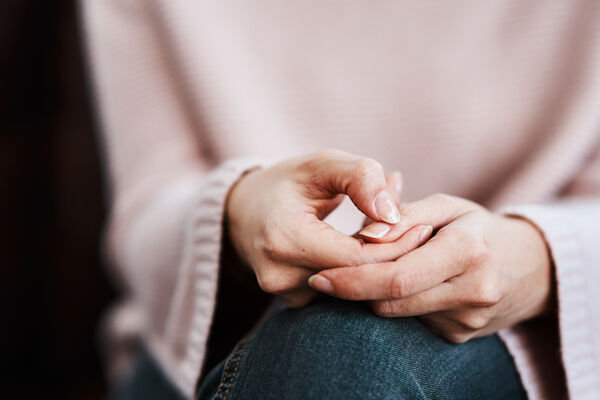 womans hand anxious