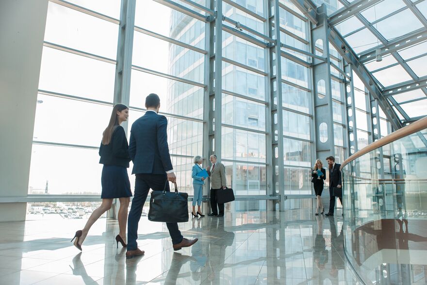 Businesspeople walking in high rise building