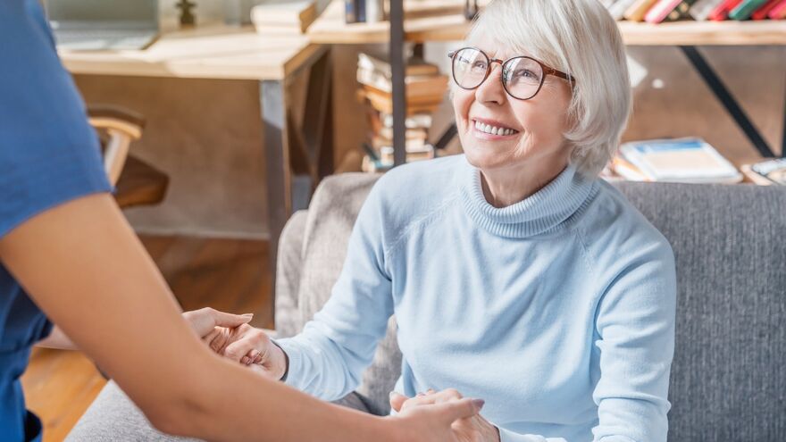Caregiver taking care of elderly lady