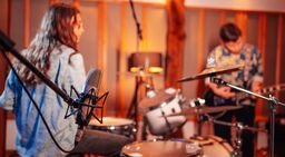 Musicians playing together in recording studio