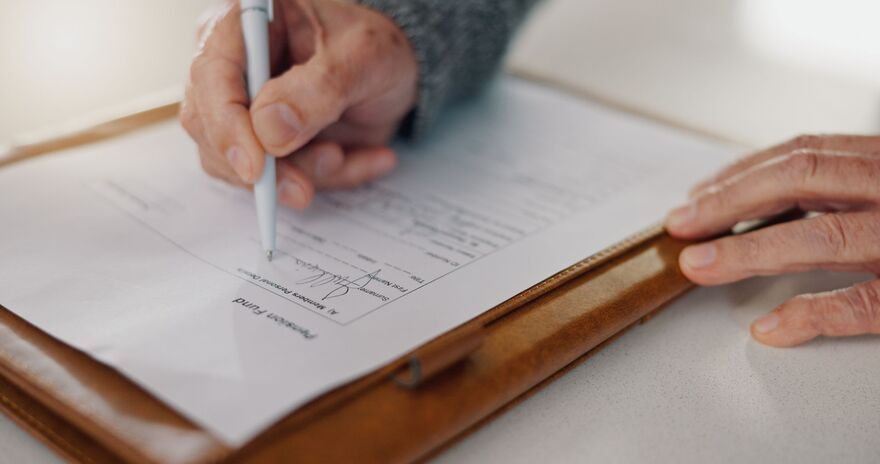 Senior person, hands and sign paper in home
