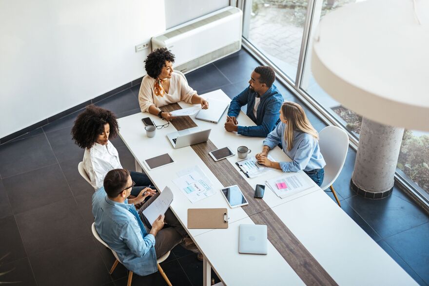 A diverse group of professionals engaged in a strategic business meeting