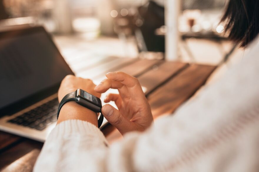 woman looking at watch