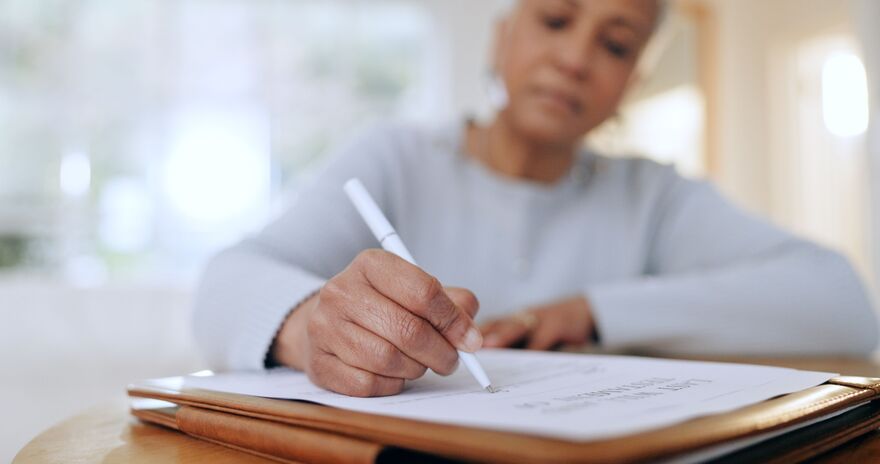 Woman signing a contract 