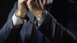 Businessman in handcuffs