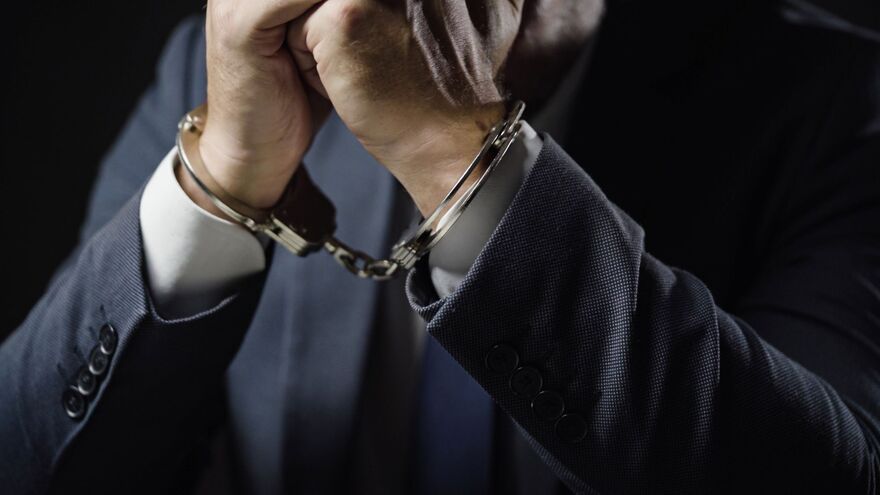 Businessman in handcuffs