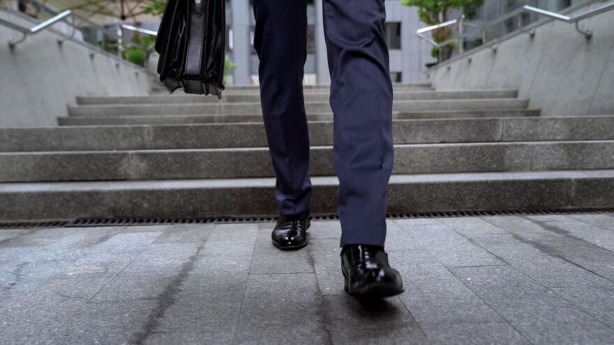 businessman walking downstairs