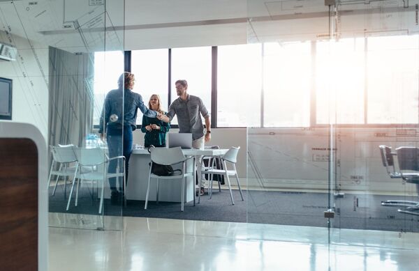 Businesspeople shaking hands after meeting 